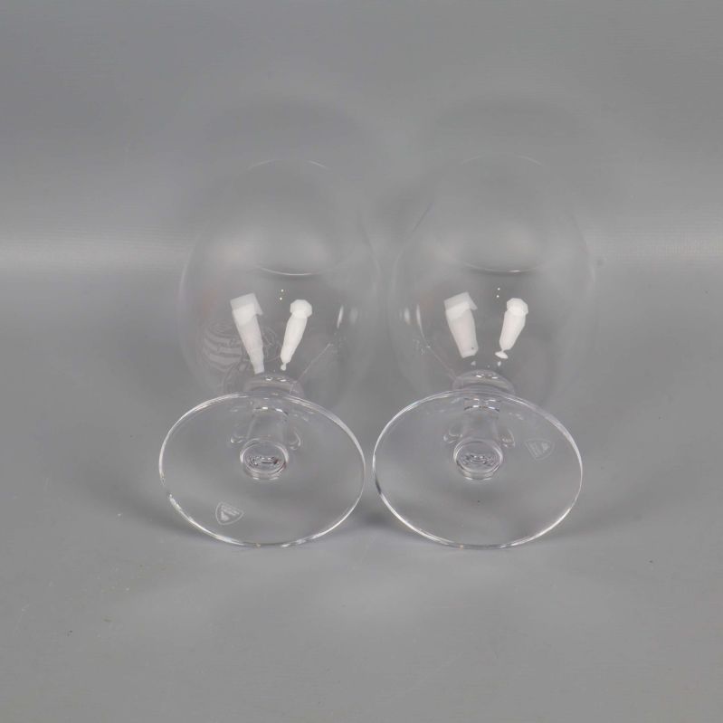 Två ölglas sedda uppifrån med tydlig fot