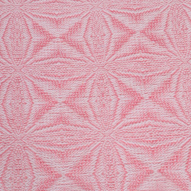 Närbild på vävt mönster i ljusrosa och vitt