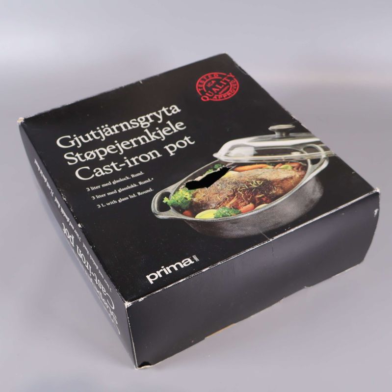 Stängd kartong till gjutjärnsgryta, produktnamn synligt