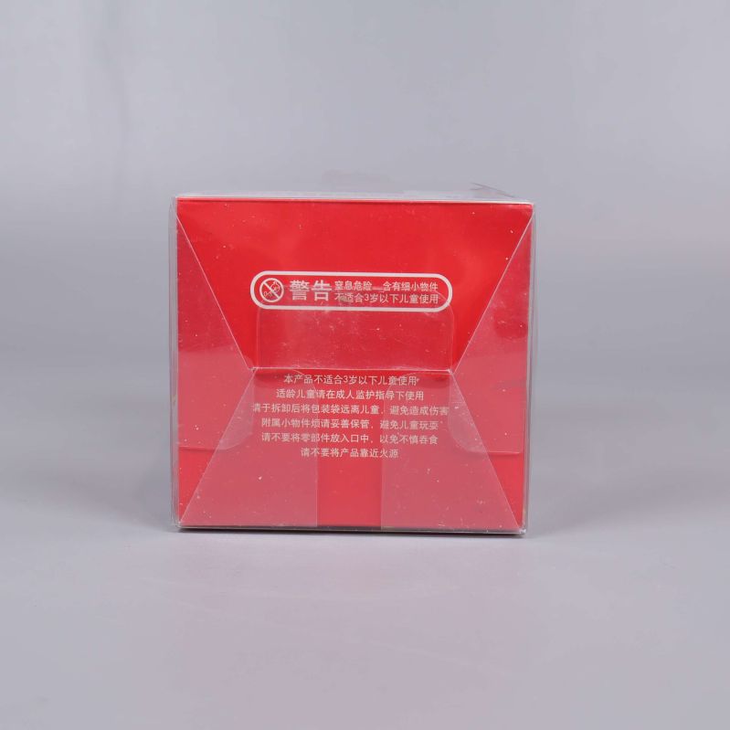 Undersida av förpackning med varningar och text på röd bakgrund