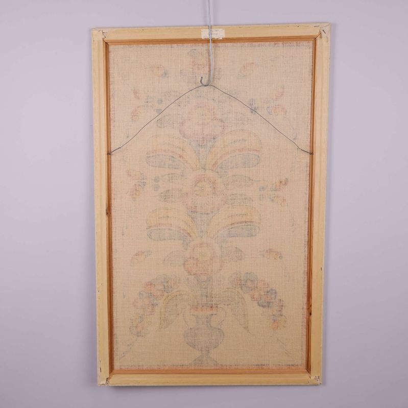 Baksidan av bonaden med upphängningsvajer