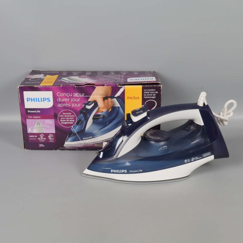 Philips strykjärn bredvid originalförpackningen