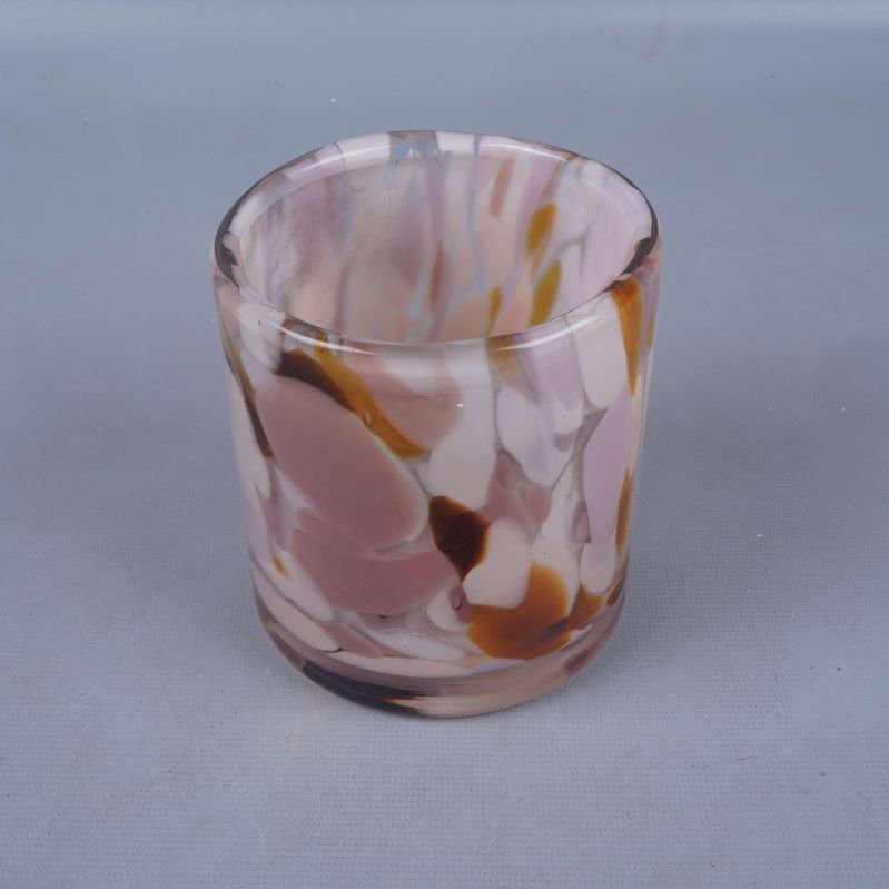 Rund glaslykta med melerat mönster i rosa och brunt