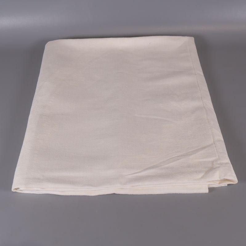 Vikt ljus bordduk vikt på grått underlag