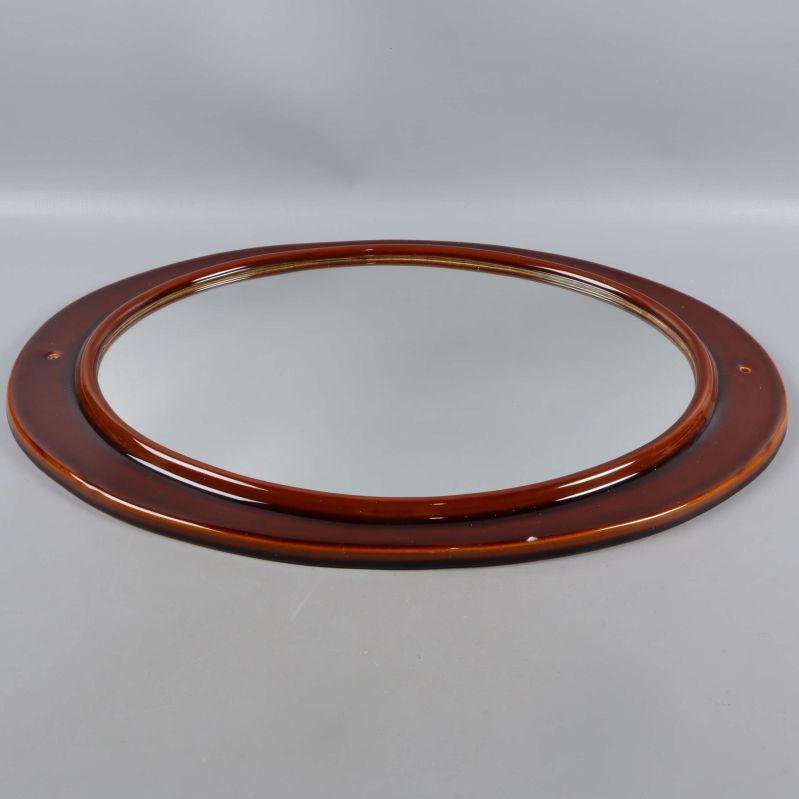 Ovalt spegelglas med blank brun porslinsram