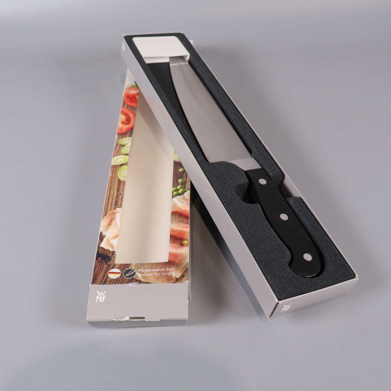 Kockkniv placerad i öppen originalförpackning