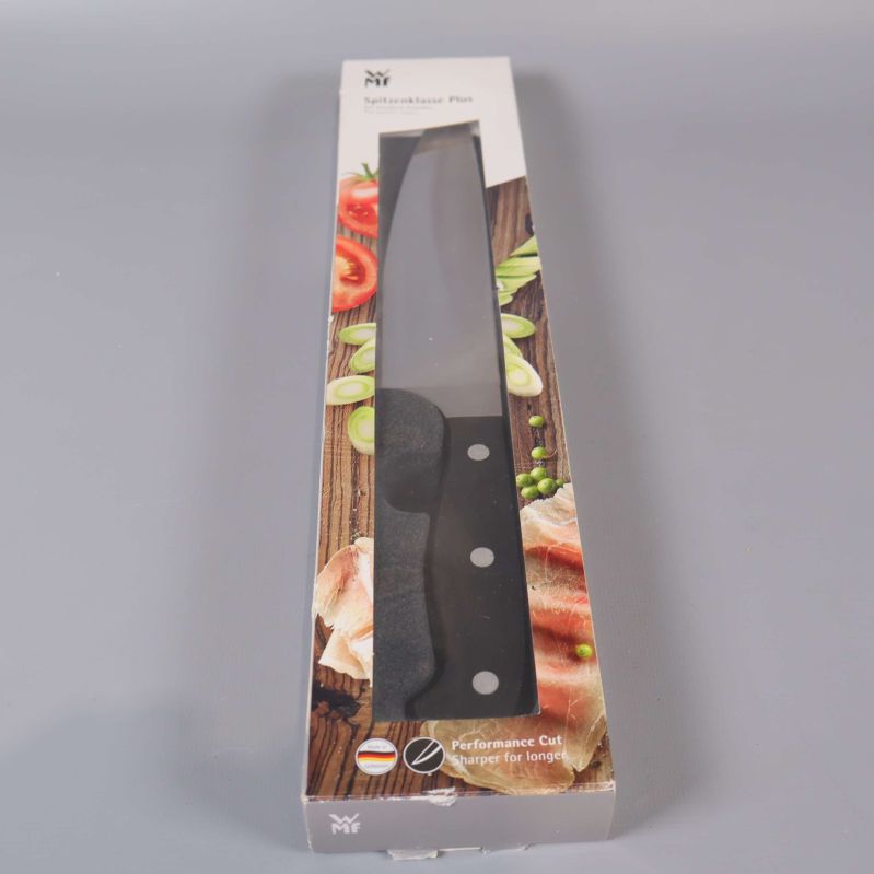 Kniv i genomskinlig förpackning med livsmedelsbilder