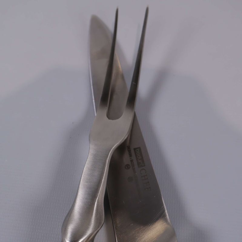 Trancherset där kniv och gaffel korsar varandra