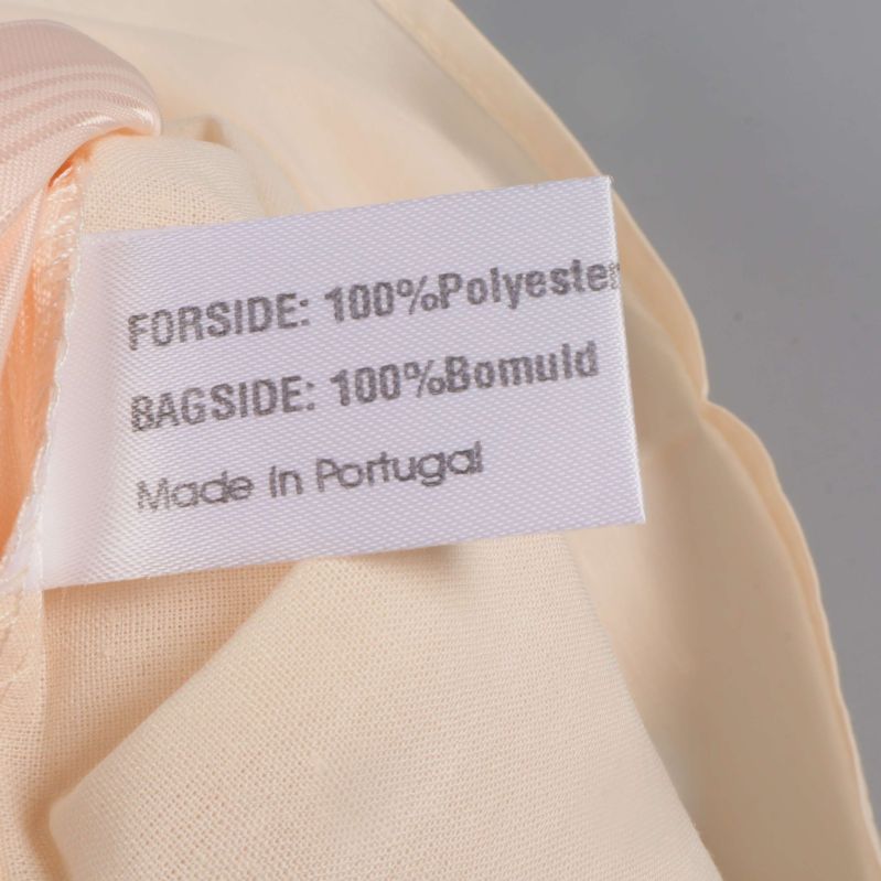 Materiallapp visar polyester och bomull