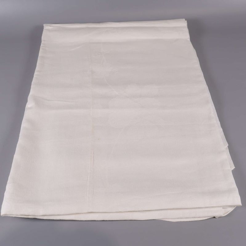 Vit duk utvikt på slät yta