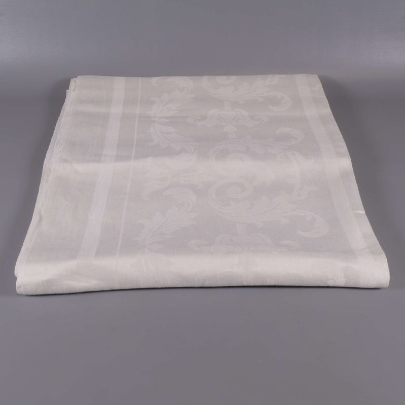 Vikt vit duk med diskret mönster