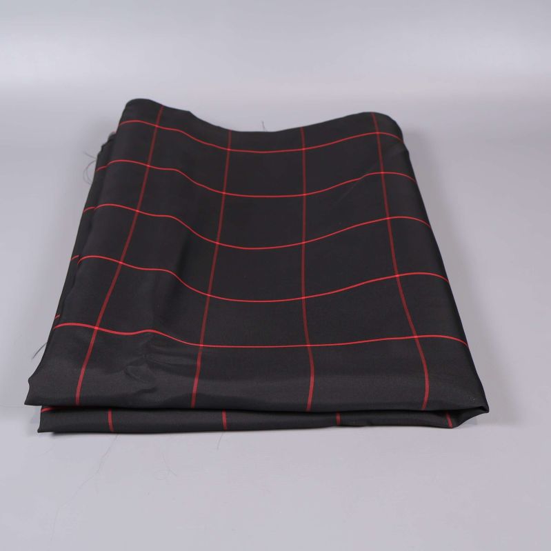 Vikt svart tyg med röda linjer