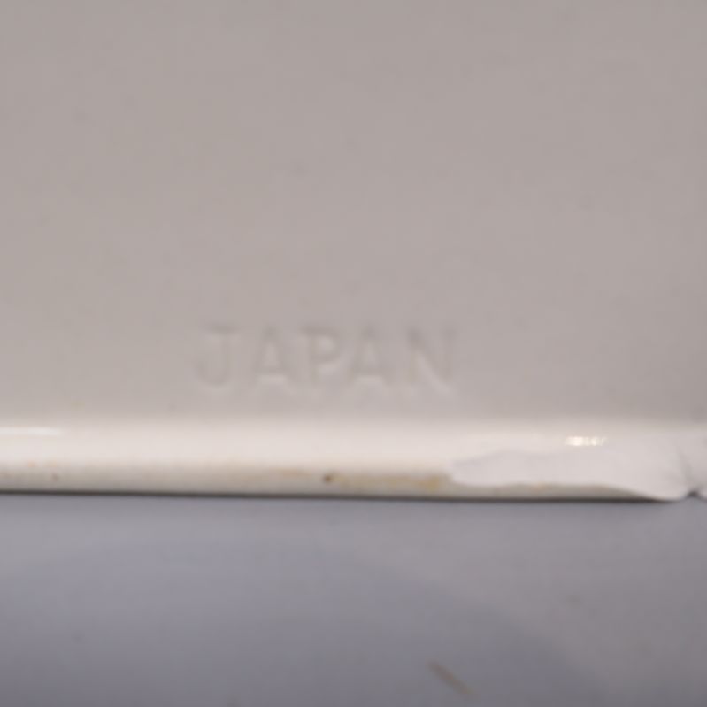 Närbild på Japan märket och liten skada 