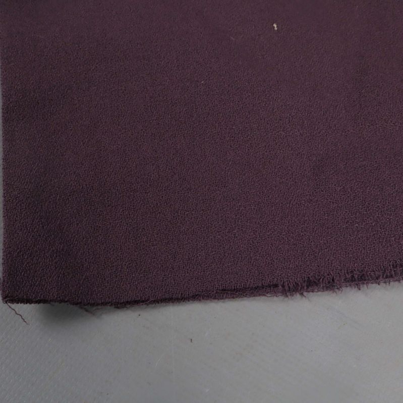 Närbild på tygkant med rå avslutning