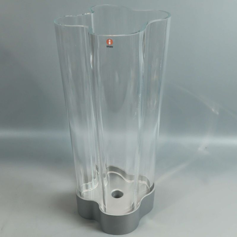 Ljuslykta i klart glas med logotyp från Iittala