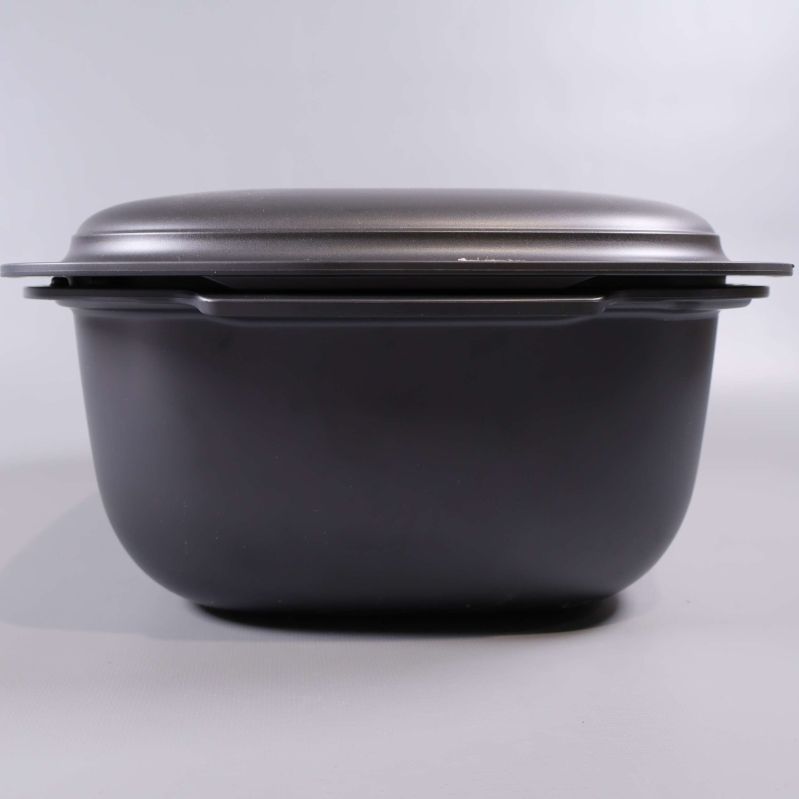 Tupperware form sedd framifrån med lock på