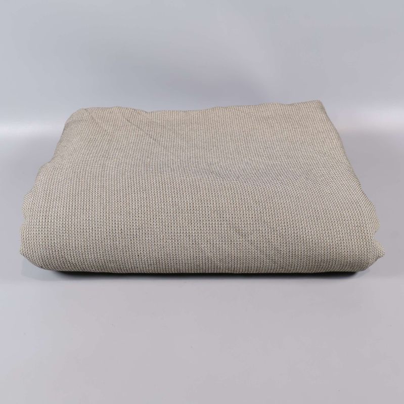 Vikt beige våfflad textil mot ljus bakgrund
