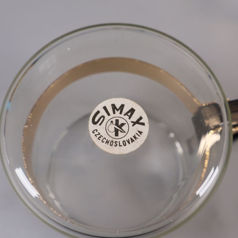 Närbild på SIMAX Czechoslovakia märkning under glaskopp