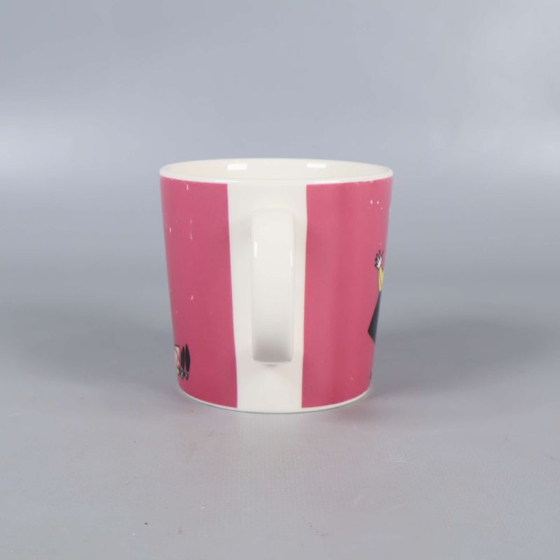 Muggens handtag och rosa design från sidan