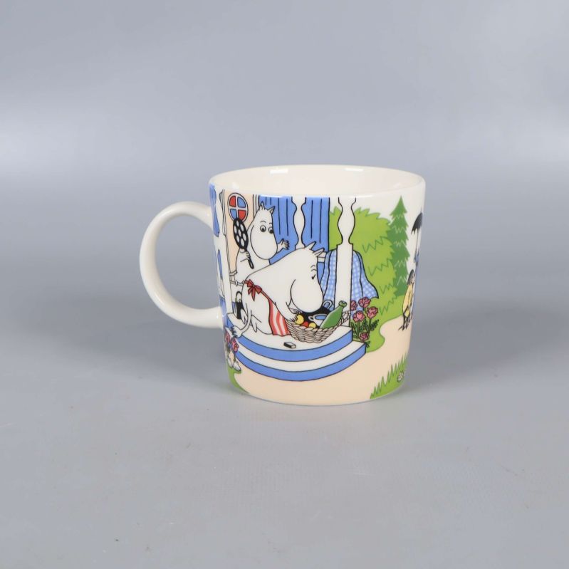 Mugg med muminmotiv och blå detaljer
