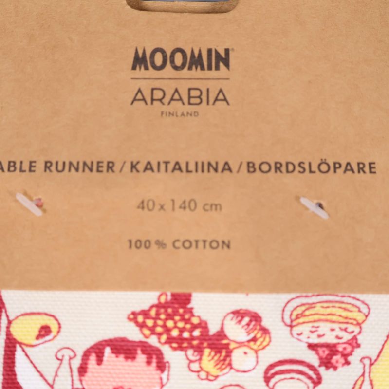 Etikett med text MOOMIN ARABIA 100% bomull