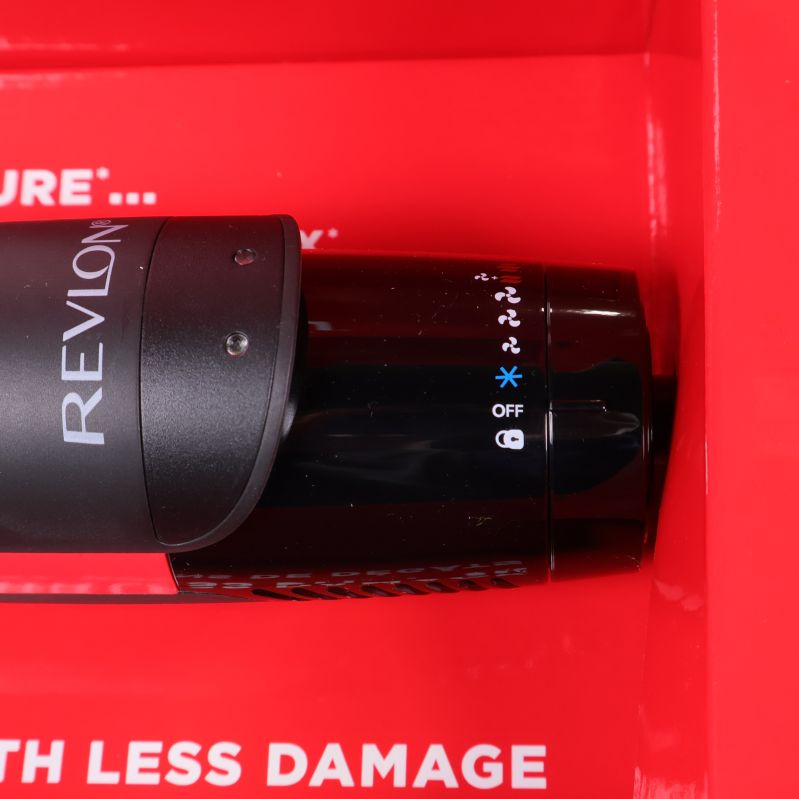 Närbild av kontrollpanel på Revlon hårtork med vred och logotyp