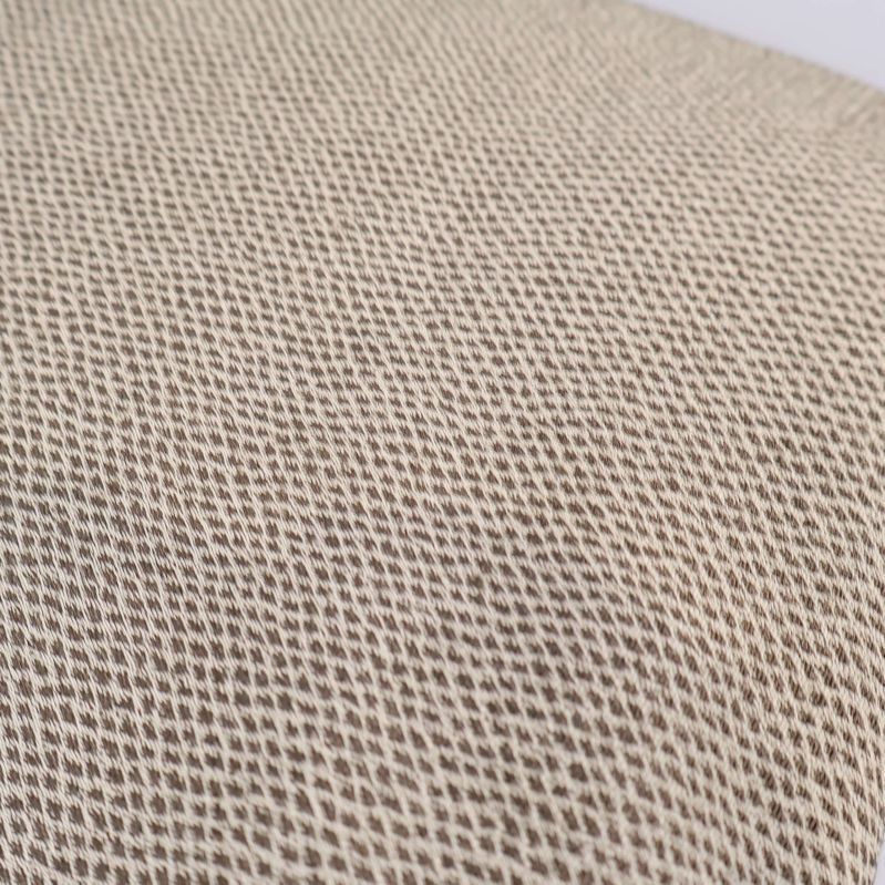 Närbild på beige tygs vävda struktur