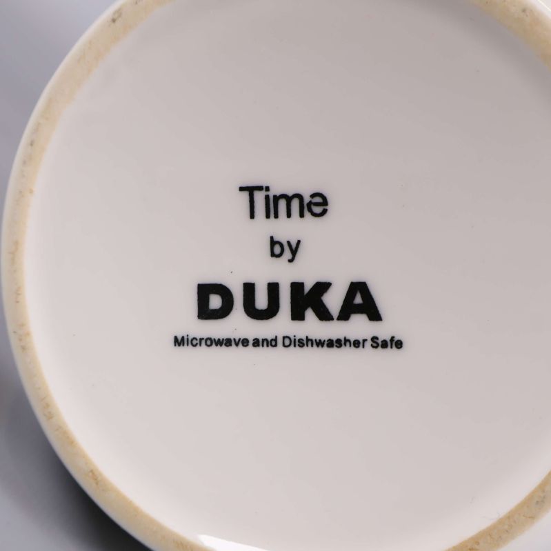 Bottenstämpel med texten Time by Duka