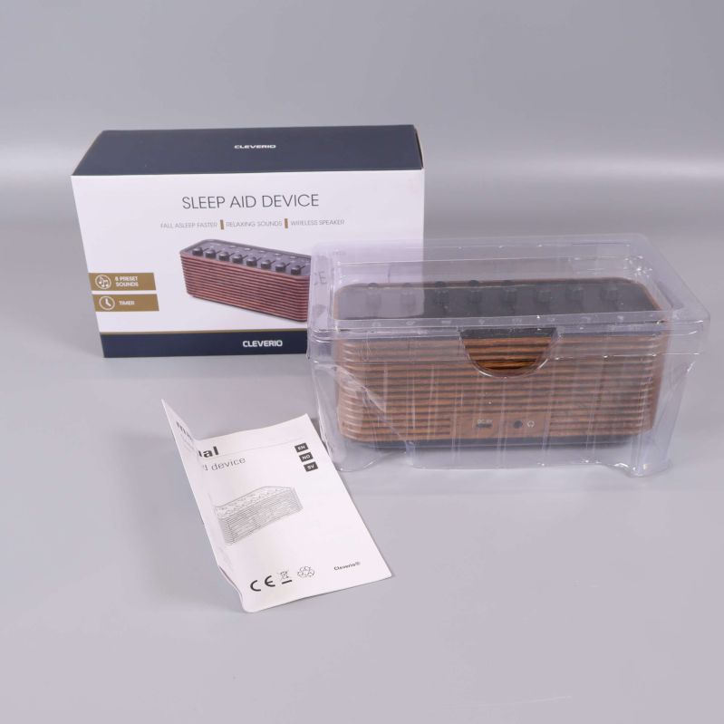 Sleep aid-enhet i plastförpackning med låda och manual