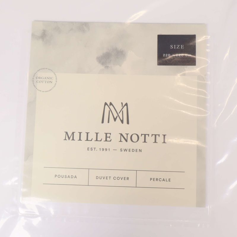 Närbild på Mille Notti etikett med logotyp och storleksinformation