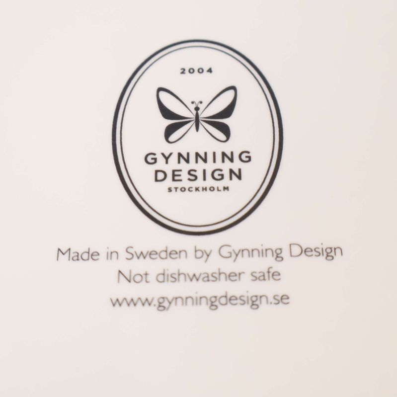 Gynning Design Stockholm logotyp och information på baksida