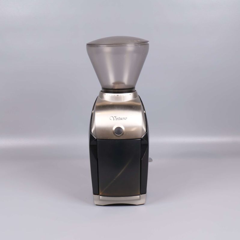 Kaffekvarn framifrån med knapp och transparent behållare