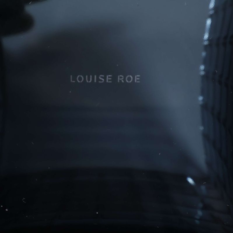 Louise Roe logotyp inuti glasvasen