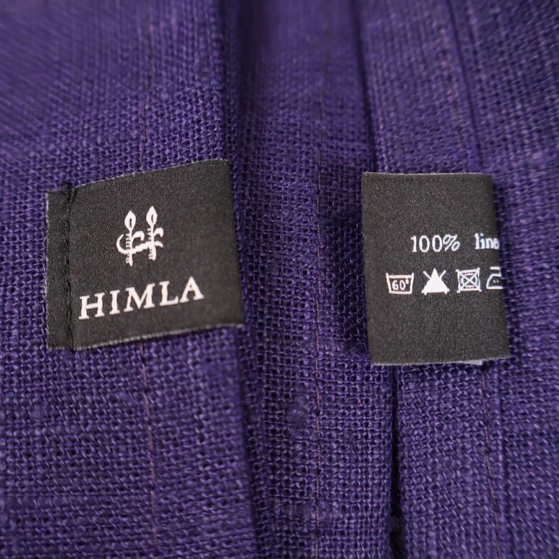 Närbild på Himla varumärkesetikett och skötselråd