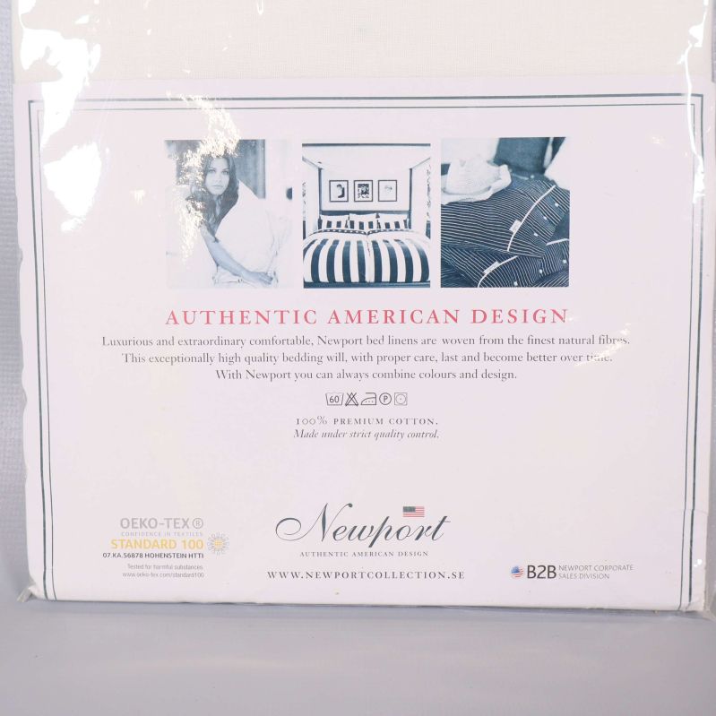 Närbild av texten authentic american design och bomullsbeskrivning