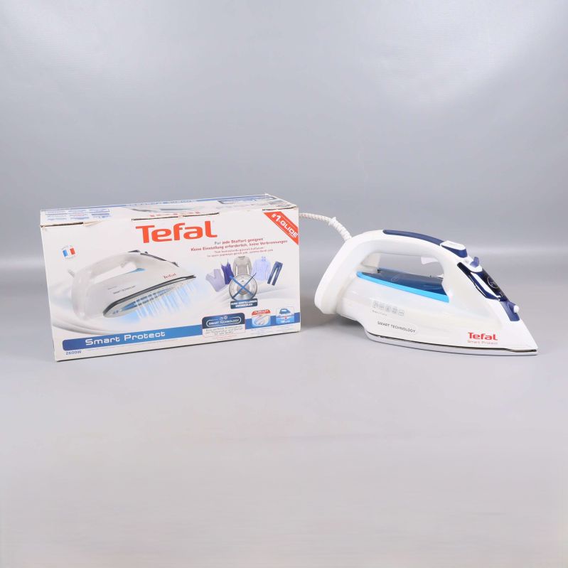 Strykjärn och originalkartong med Tefal-logotyp