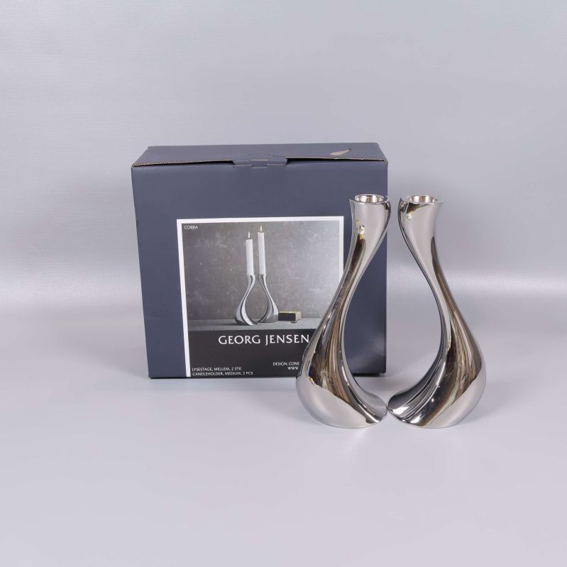 Två blanka ljusstakar med originalförpackning från Georg Jensen