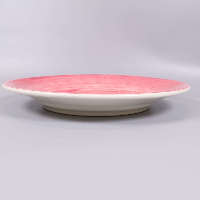 Serveringsfat med rosa swirl-mönster från låg sida