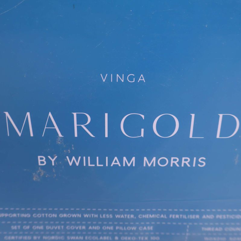 Förpackning med texten Vinga Marigold by William Morris