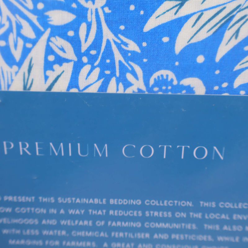 Premium cotton-etikett på blå förpackning