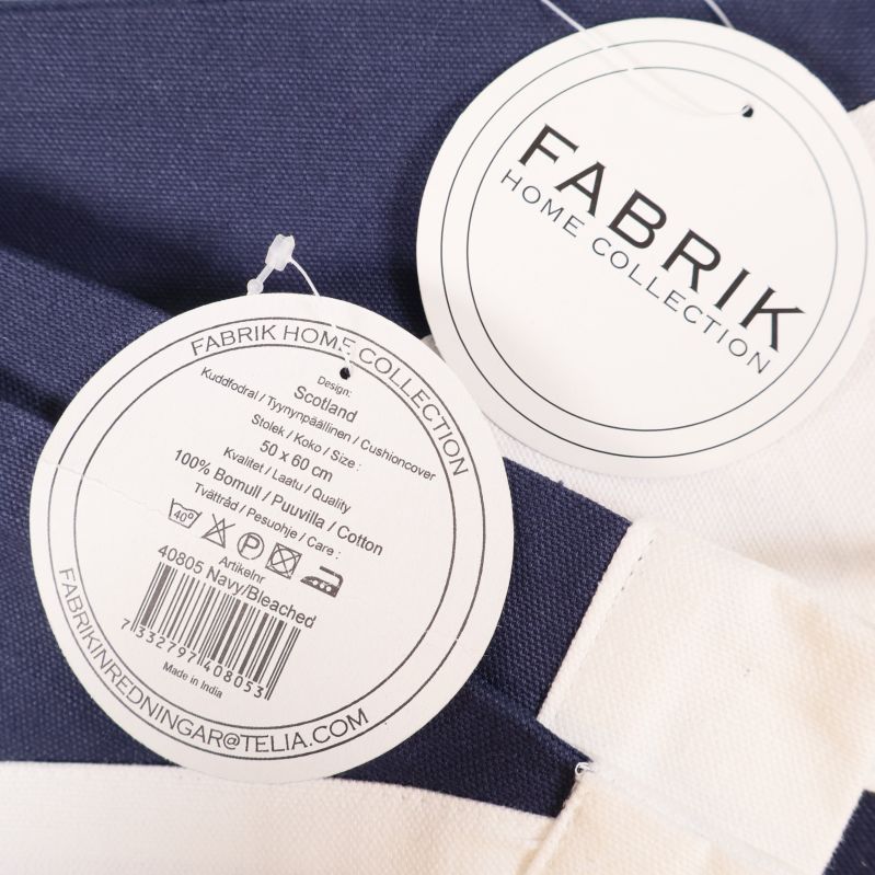 Närbild på etikett från Fabrik Home Collection