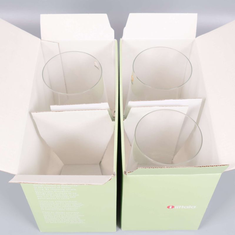 Två öppna förpackningar med Iittala Tumbler-glas i originalkartong