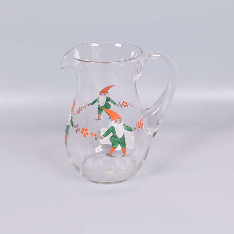 Glaskanna med tomtar och orange detaljer