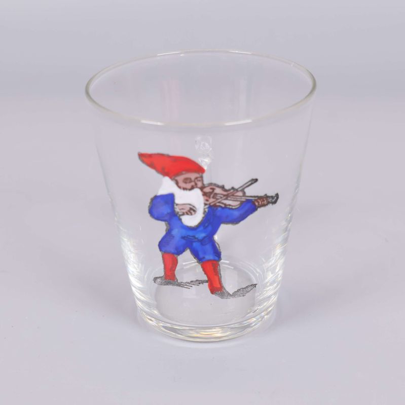 Enskilt glas med tomte som spelar fiol