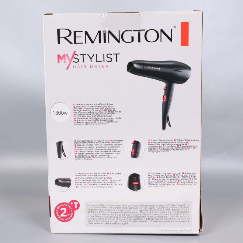 Baksidan av kartongen med produktinformation om Remington hårfön