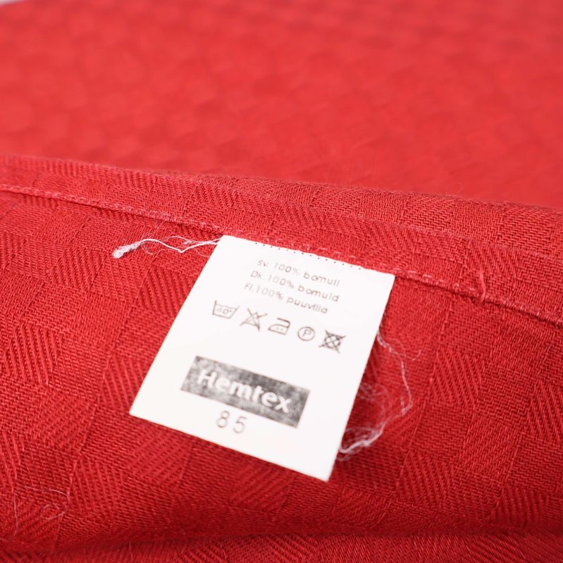 Produktetikett med Hemtex-logga och materialinformation