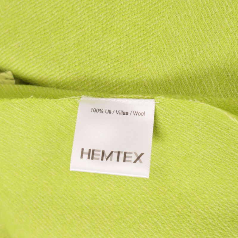 Produktetikett visar Hemtex och 100% ull