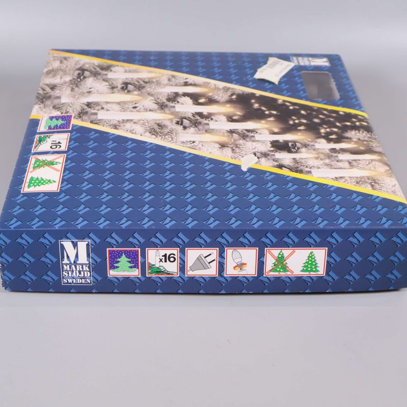 Nederdel av förpackning med Mark Slöjd Sweden-logotyp och symboler