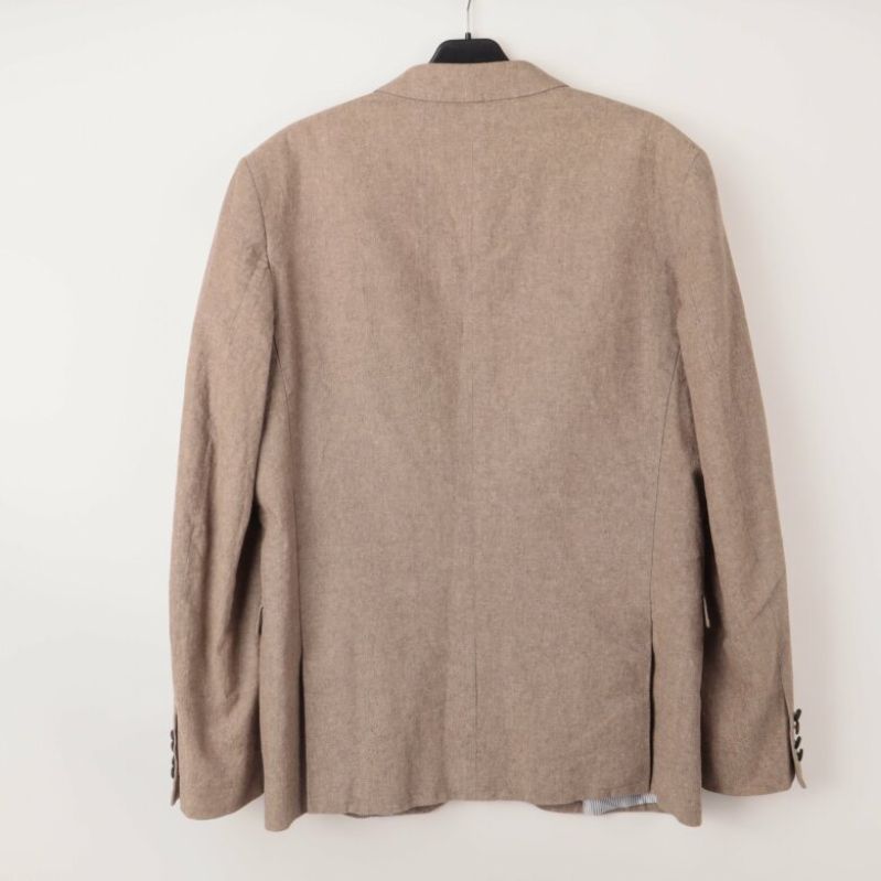 Baksidan av beige kavaj