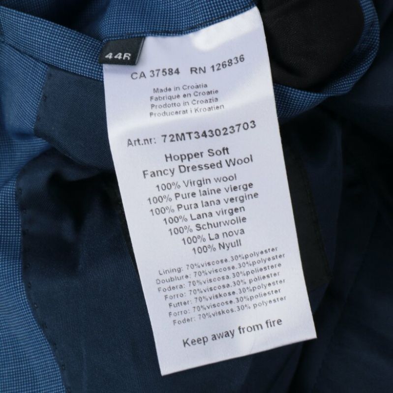 Materialetikett med information: 100% ull